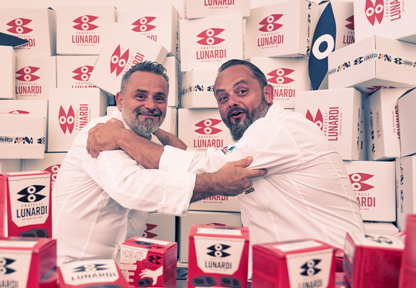 Massimiliano and Riccardo Lunardi with their boxes and packs