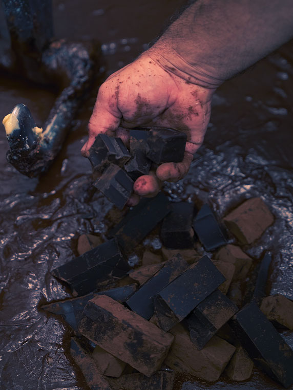Hand holding pieces of chocolate
