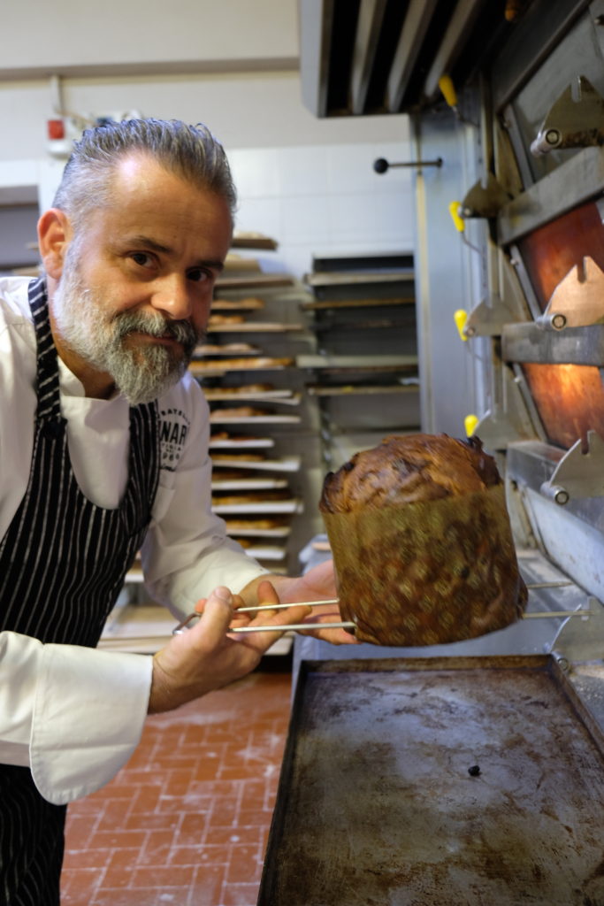 Massimiliano Lunardi holding a panettone