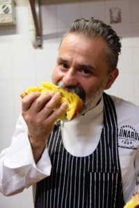 Massimiliano Lunardi eating a slice of panettone