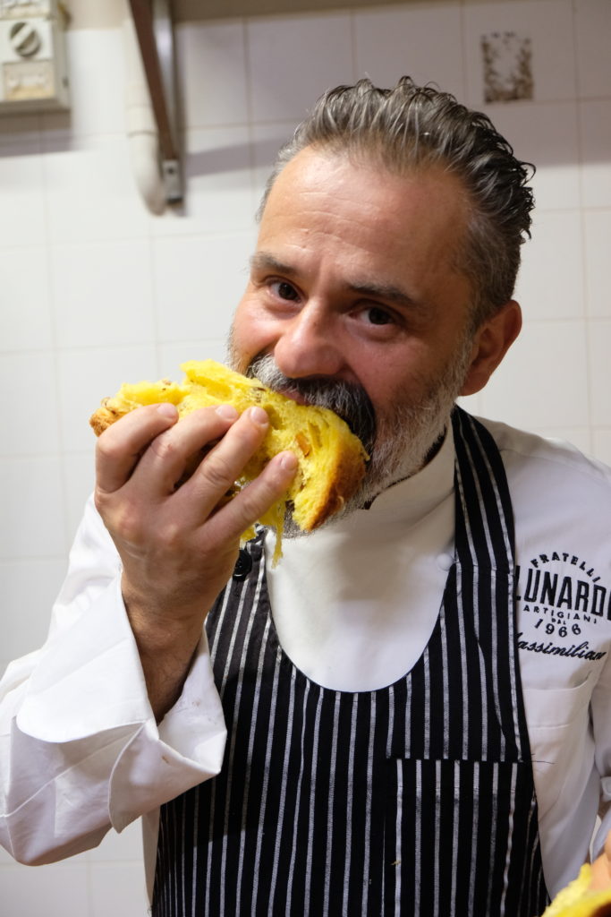 Massimiliano Lunardi eating a slice of panettone